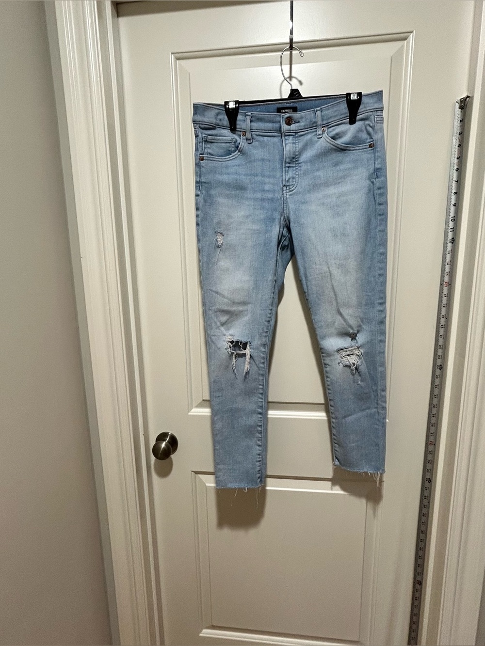 Express womens size 10R Light Wash Distressed raw edge skinny mid rise Jeans